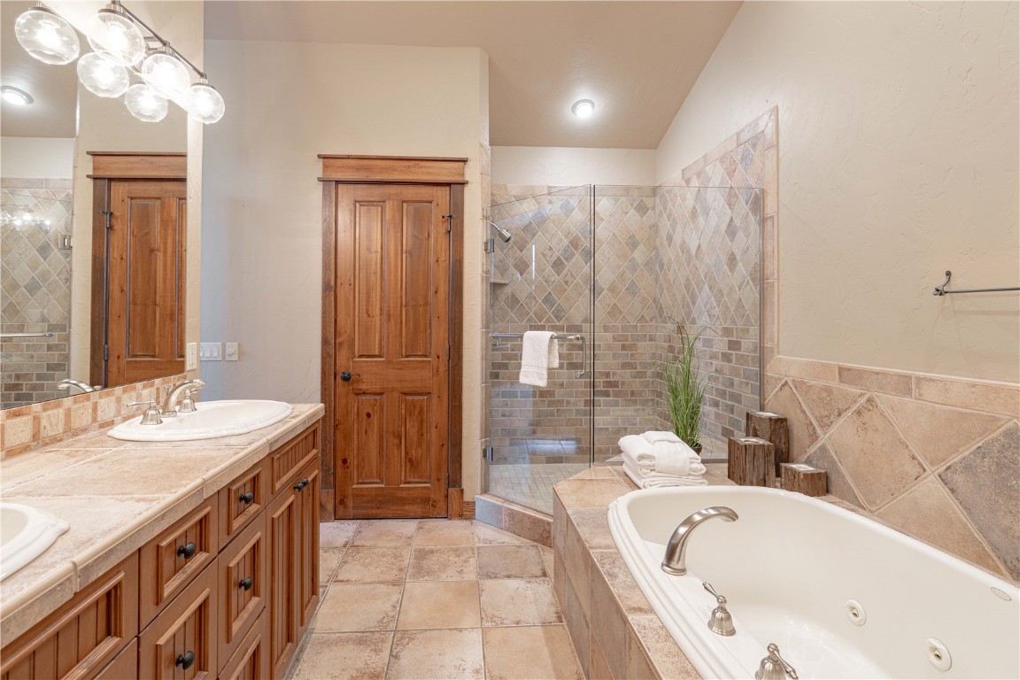 71 Cucumber Patch Placer Road, Unit 7 Breckenridge, CO 80424 - Photo 10 of 21 a spacious bathroom with a tub sink and mirror