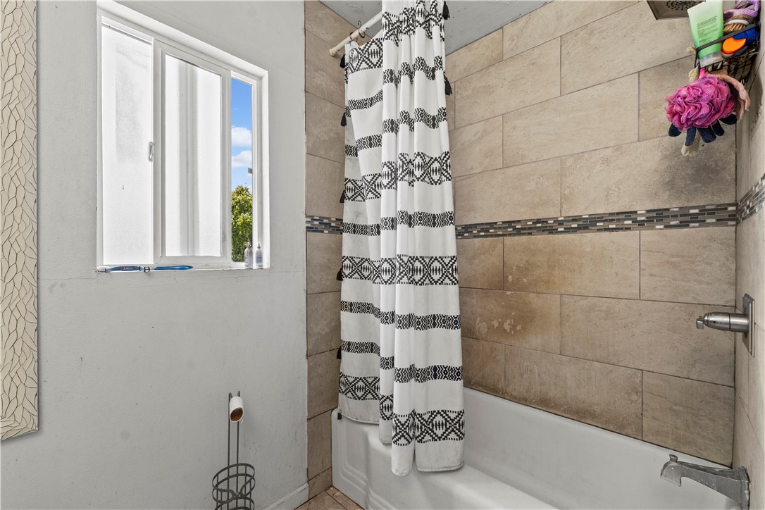 2725 East Tyler Street Carson, CA 90810 - Photo 9 of 30 a bathroom with a shower