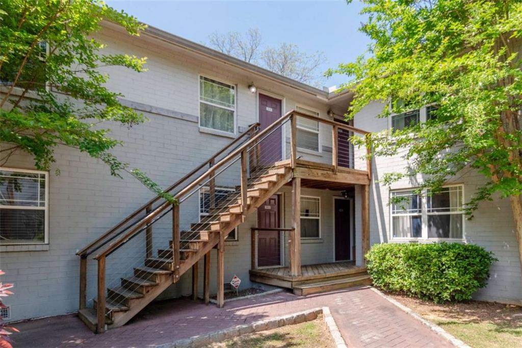24 Daniel Street Southeast, Unit 8 Atlanta, GA 30312 - Photo 1 of 29 a front view of a house with a yard