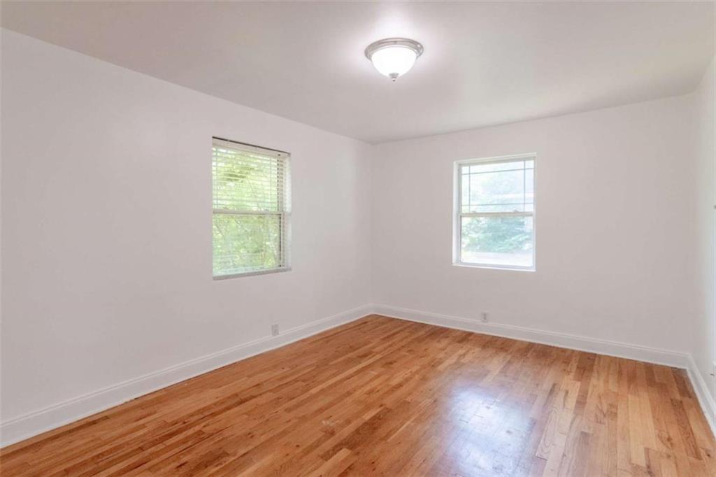 24 Daniel Street Southeast, Unit 8 Atlanta, GA 30312 - Photo 19 of 29 an empty room with wooden floor and windows