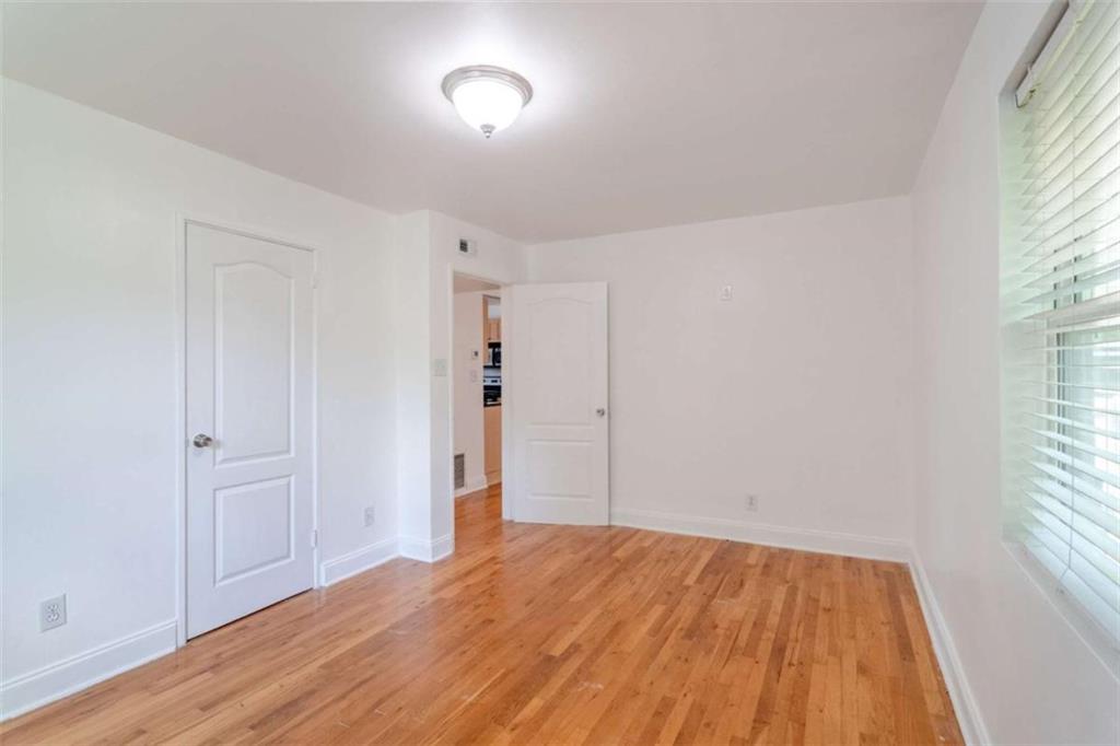 24 Daniel Street Southeast, Unit 8 Atlanta, GA 30312 - Photo 21 of 29 an empty room with wooden floor and windows