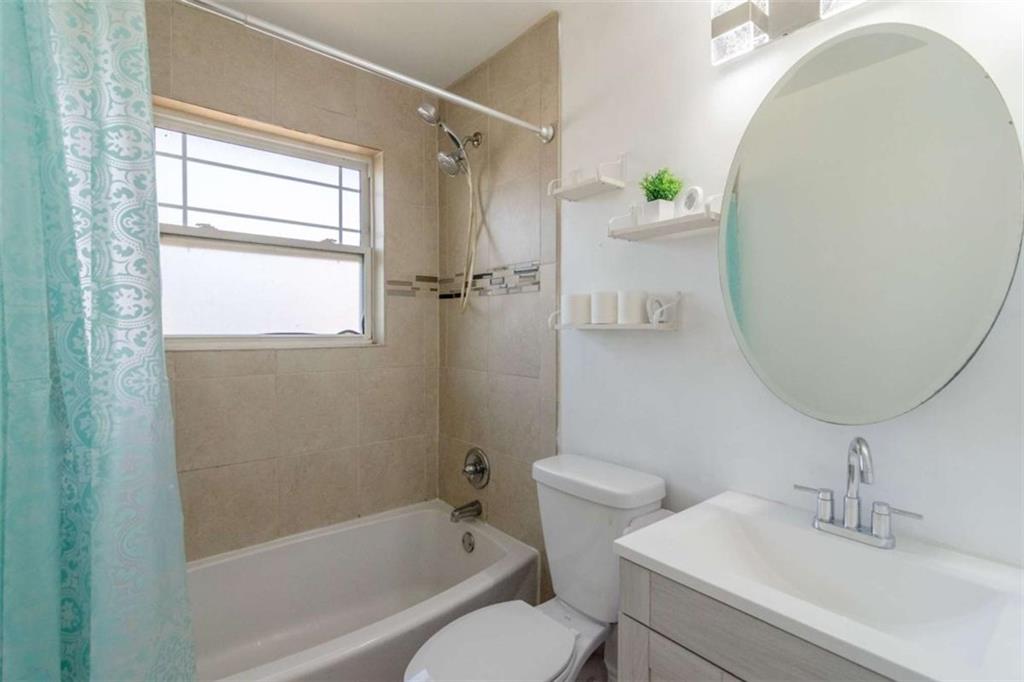 24 Daniel Street Southeast, Unit 8 Atlanta, GA 30312 - Photo 25 of 29 a white toilet sitting next to a bathroom sink