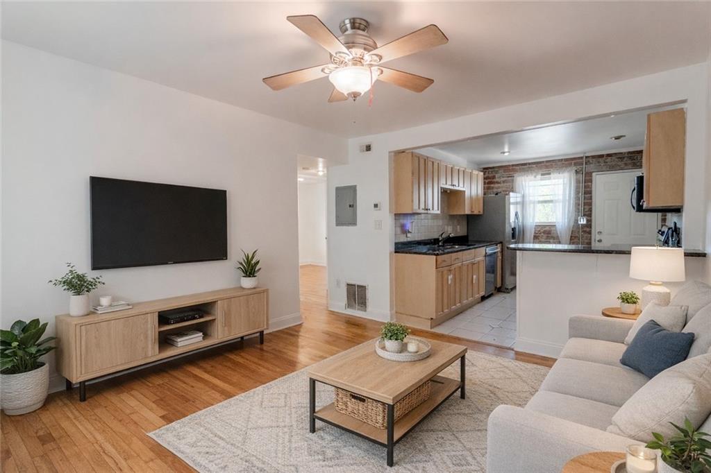 24 Daniel Street Southeast, Unit 8 Atlanta, GA 30312 - Photo 6 of 29 a living room with furniture and a flat screen tv