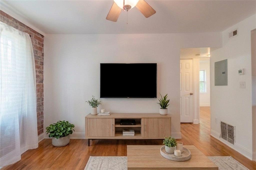 24 Daniel Street Southeast, Unit 8 Atlanta, GA 30312 - Photo 8 of 29 a living room with furniture and a flat screen tv
