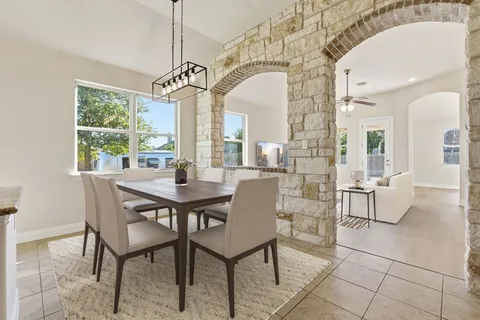 a view of a dining room with furniture window and outside view