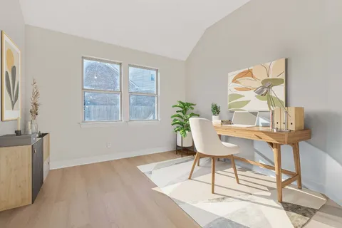 a workspace with furniture and a window