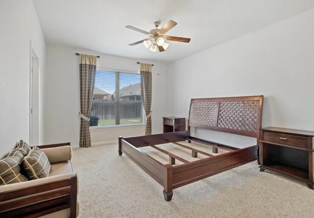 a bathroom with a double vanity sink mirror and bathtub