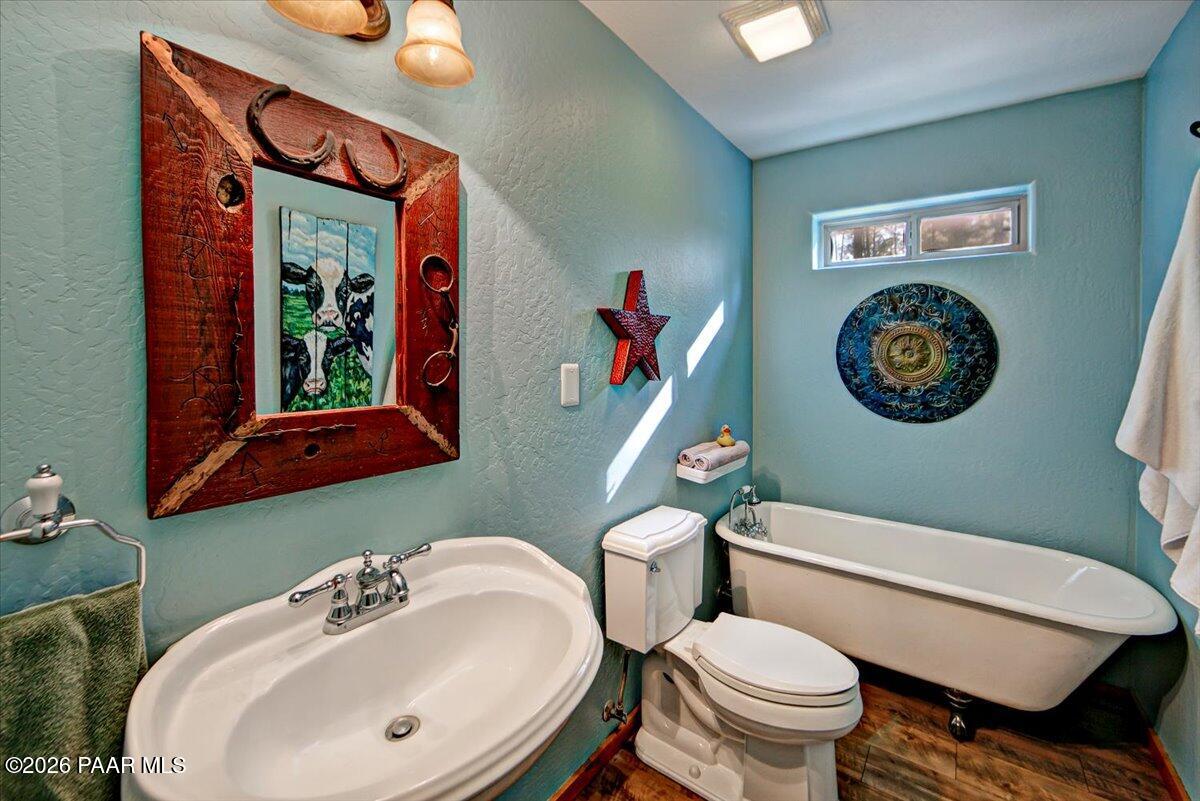 835 Happy Valley Road Prescott, AZ 86305 - Photo 19 of 48 a bathroom with a toilet a sink and a mirror