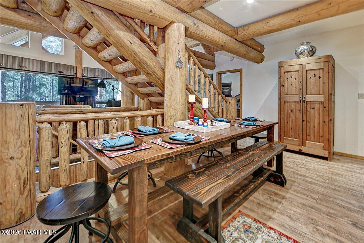 835 Happy Valley Road Prescott, AZ 86305 - Photo 10 of 48 a dining room with furniture and wooden floor