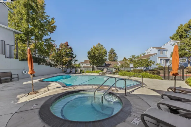 a view of a swimming pool with a patio