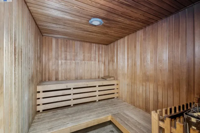 a view of a room with stairs and a wooden door