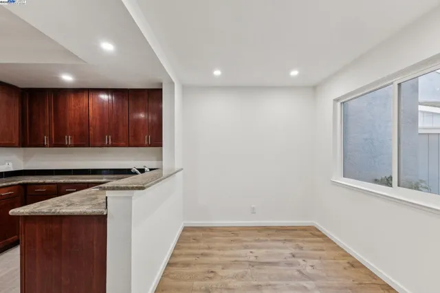 a view of a livingroom with furniture and window in a room