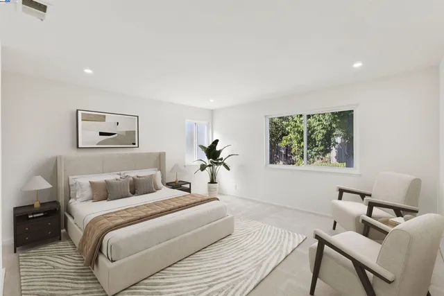 a bedroom with a bed and a chair