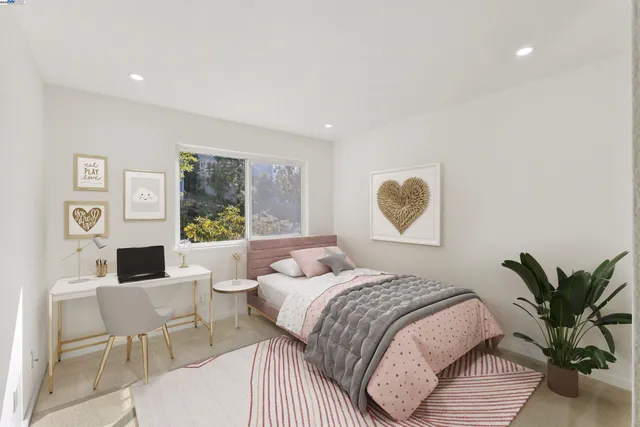 a bedroom with a large bed and a table