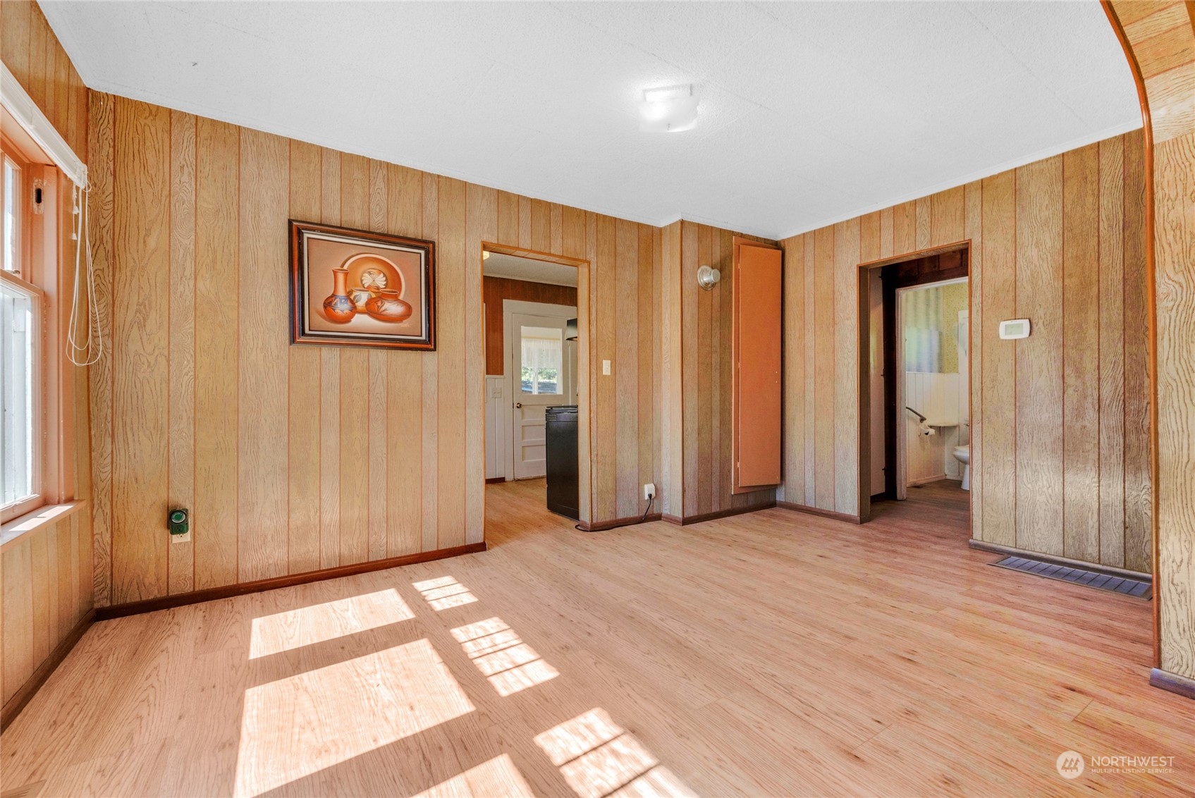 5416 Rockefeller Avenue Everett, WA 98203 - Photo 5 of 35 a view of a hallway with wooden floor