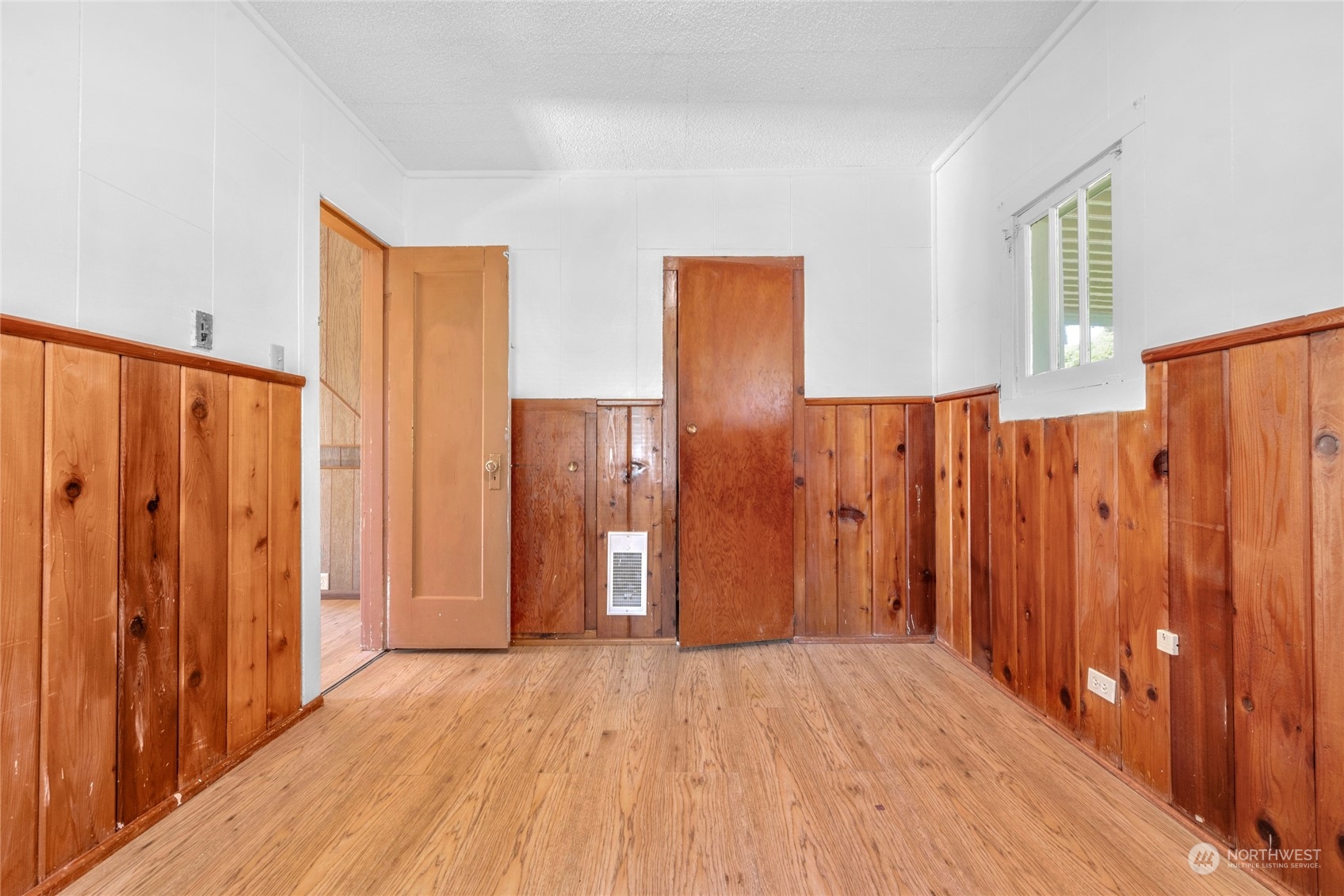5416 Rockefeller Avenue Everett, WA 98203 - Photo 9 of 35 a view of wooden floor and windows in a room