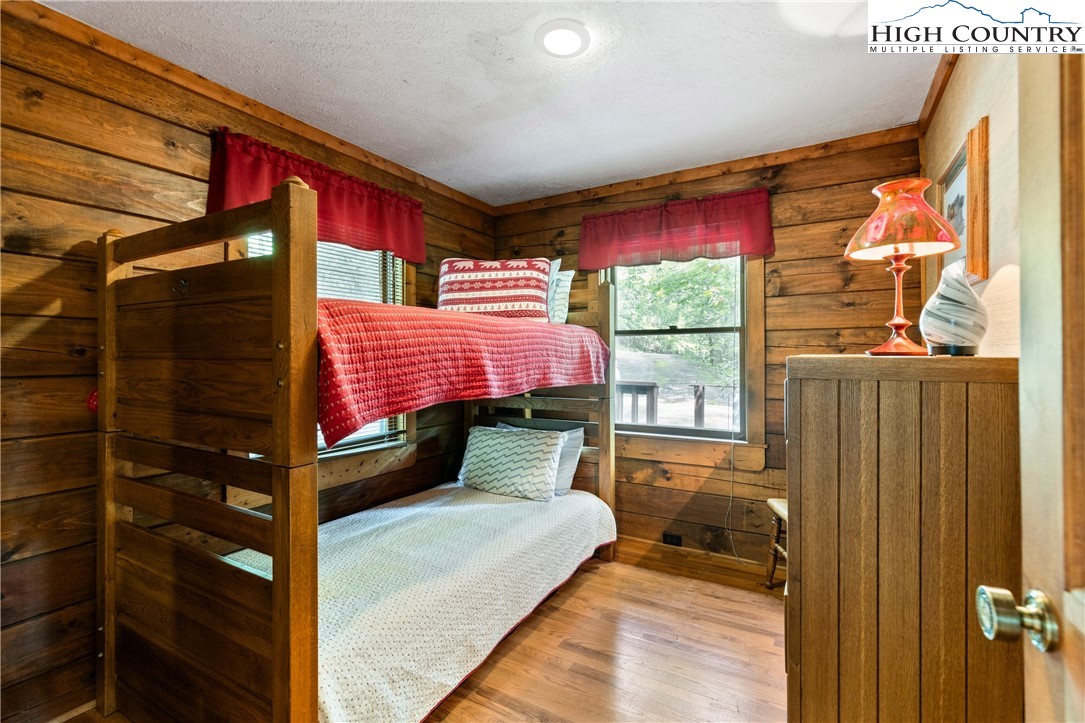 289 Grandview Drive Seven Devils, NC 28604 - Photo 22 of 43 a bedroom with a bed and window