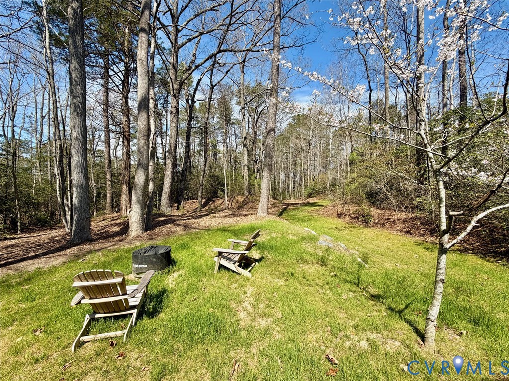 43 Ruddy Duck Road Heathsville, VA 22473 - Photo 37 of 46 a backyard of a house with table and chairs
