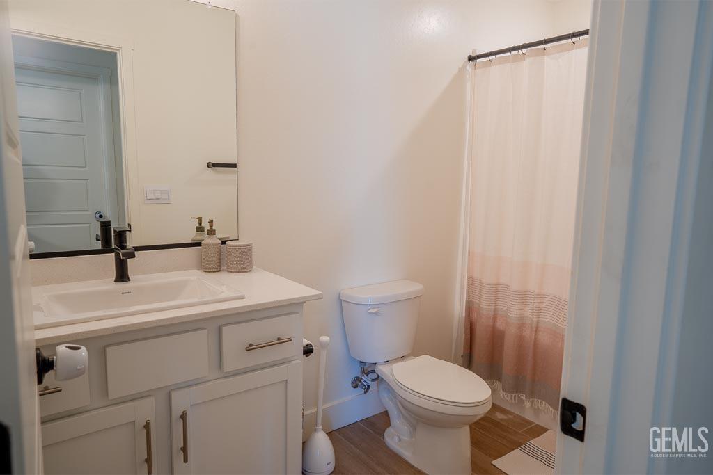 Undisclosed Address Bakersfield, CA 93311 - Photo 14 of 24 a bathroom with a sink a toilet and shower