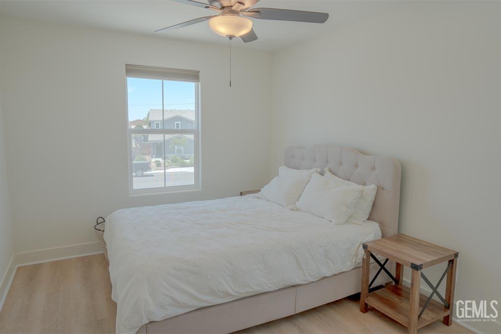 Undisclosed Address Bakersfield, CA 93311 - Photo 17 of 24 a bedroom with a bed and a window