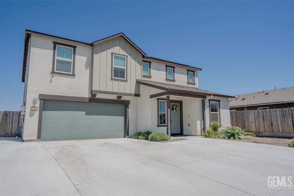 Undisclosed Address Bakersfield, CA 93311 - Photo 2 of 24 a front view of a house with garage and garage