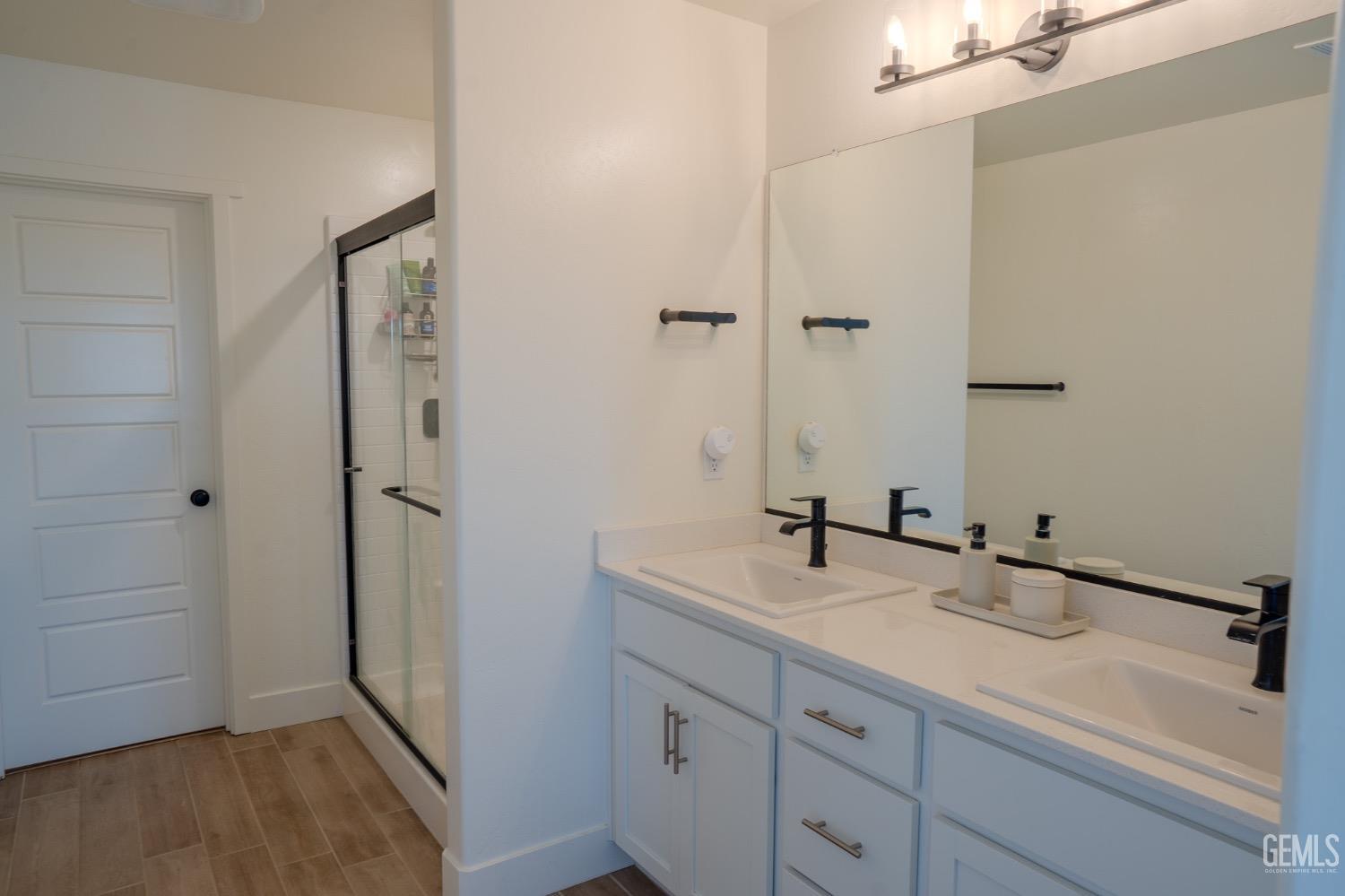 Undisclosed Address Bakersfield, CA 93311 - Photo 21 of 24 a bathroom with a sink and a mirror