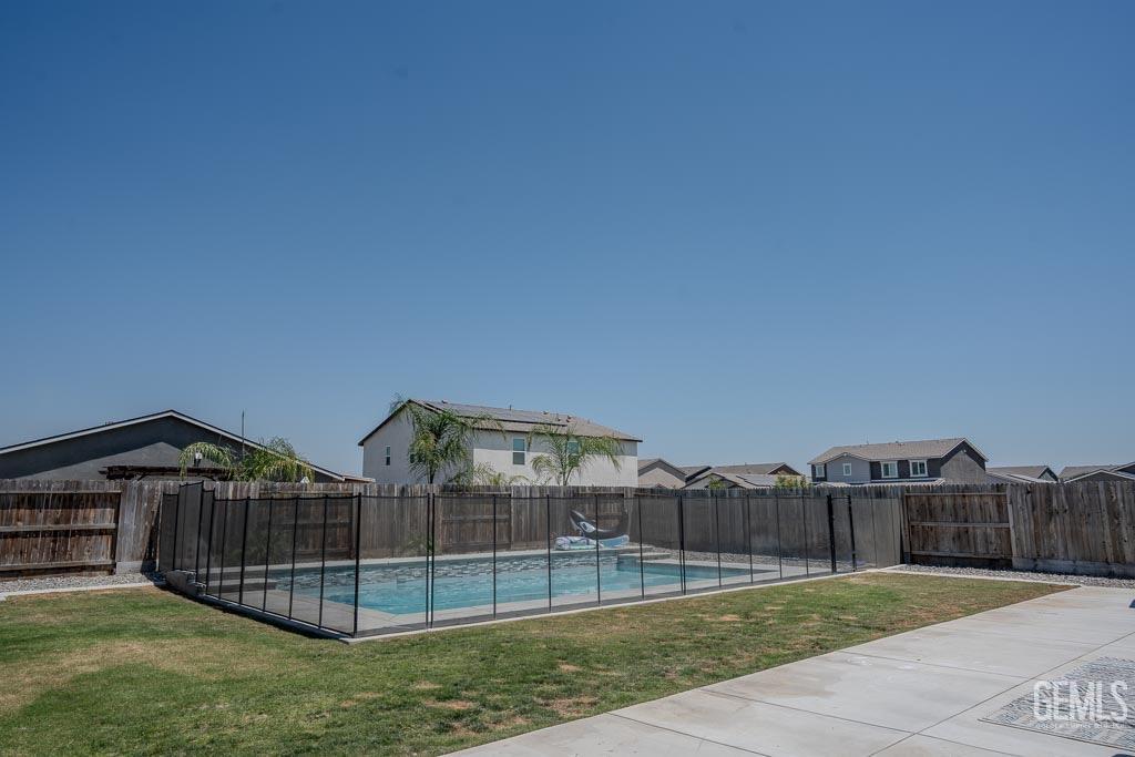 Undisclosed Address Bakersfield, CA 93311 - Photo 22 of 24 a view of a house with a yard and a sink