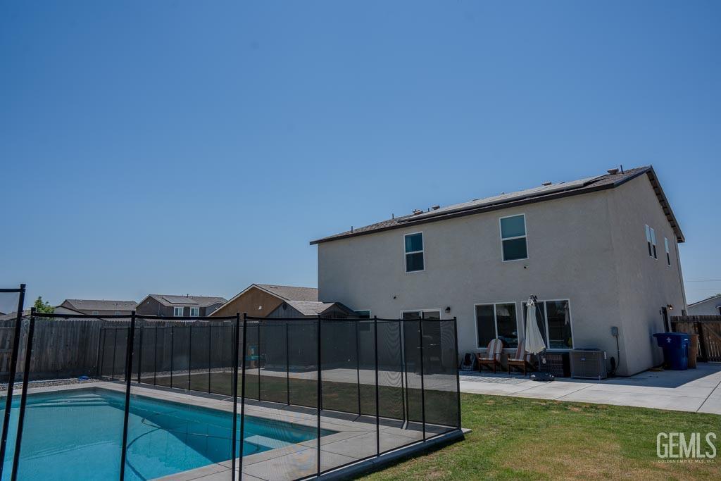 Undisclosed Address Bakersfield, CA 93311 - Photo 23 of 24 a patio with table and chairs