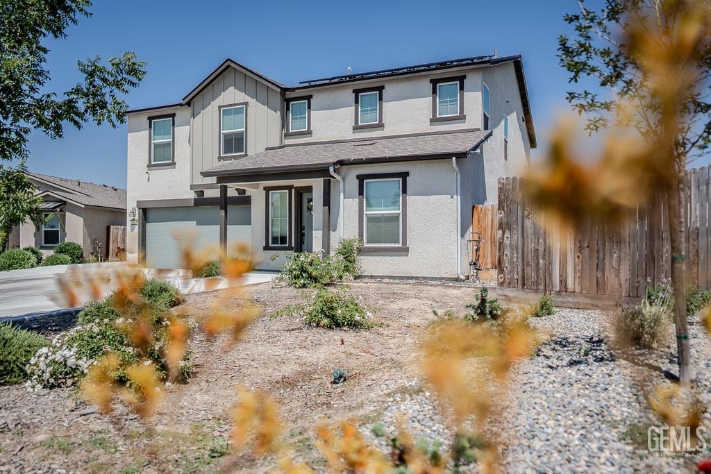 Undisclosed Address Bakersfield, CA 93311 - Photo 3 of 24 a front view of a house with garden