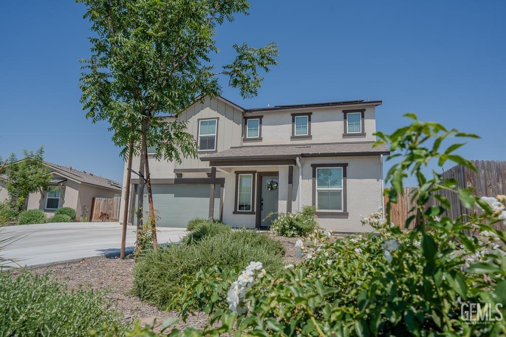 Undisclosed Address Bakersfield, CA 93311 - Photo 4 of 24 a front view of a house with garden