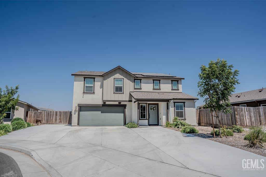 Undisclosed Address Bakersfield, CA 93311 - Photo 5 of 24 a front view of a house with yard and parking