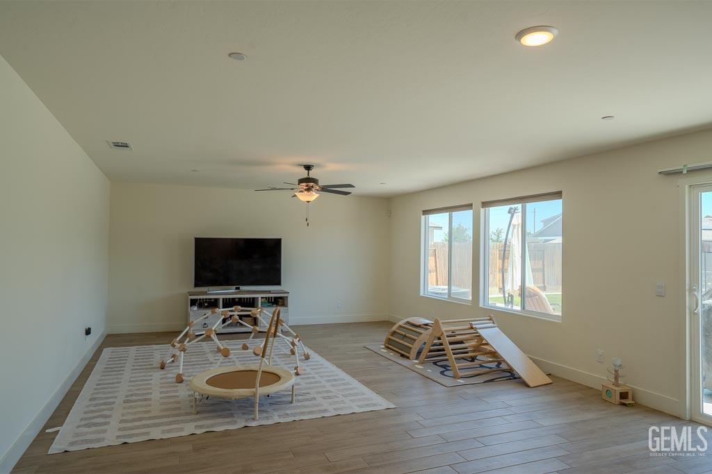Undisclosed Address Bakersfield, CA 93311 - Photo 7 of 24 a view of a livingroom with furniture and a flat screen tv