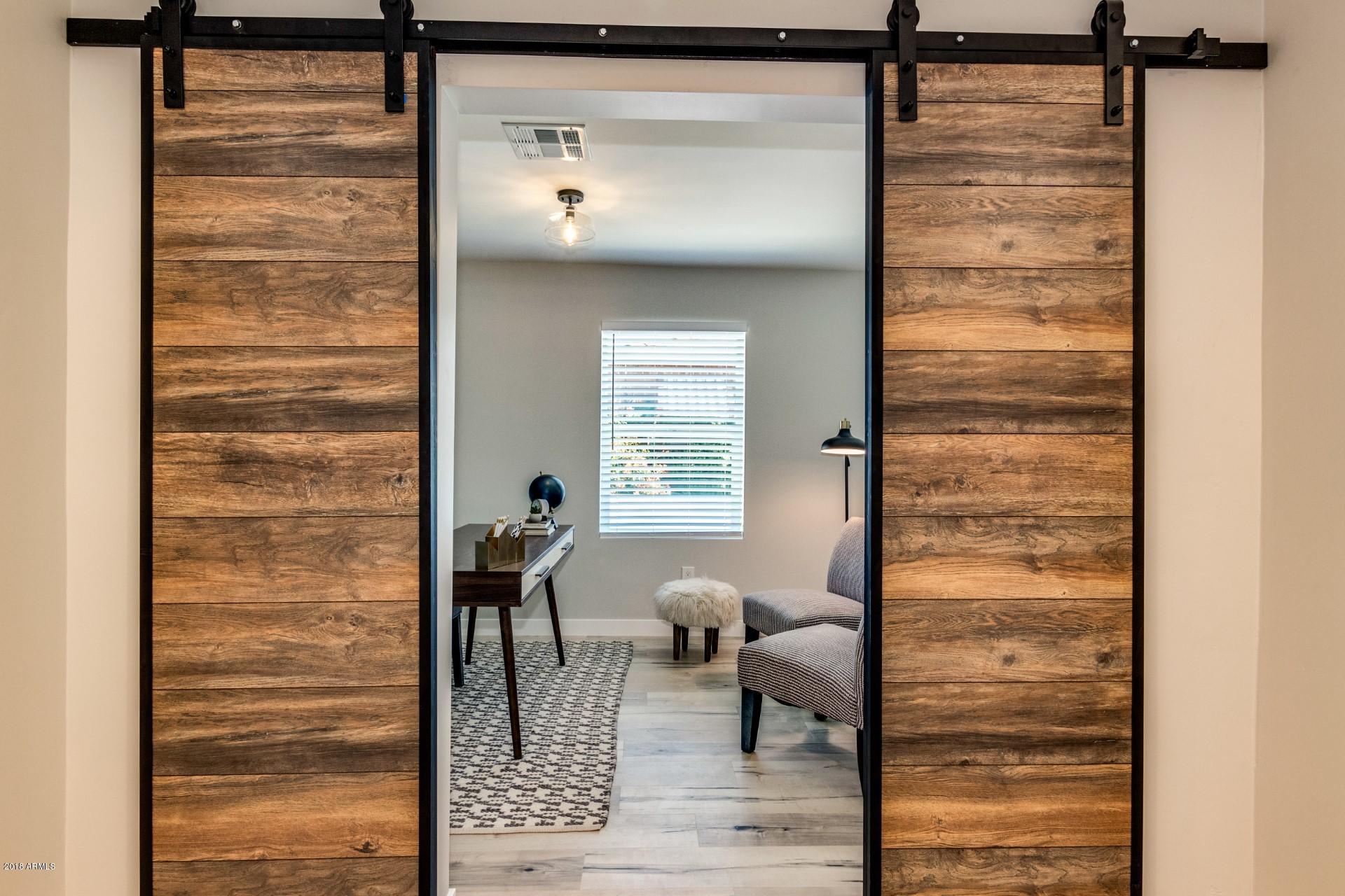 1438 East Granada Road Phoenix, AZ 85006 - Photo 20 of 35 a view of a hallway with windows and couch