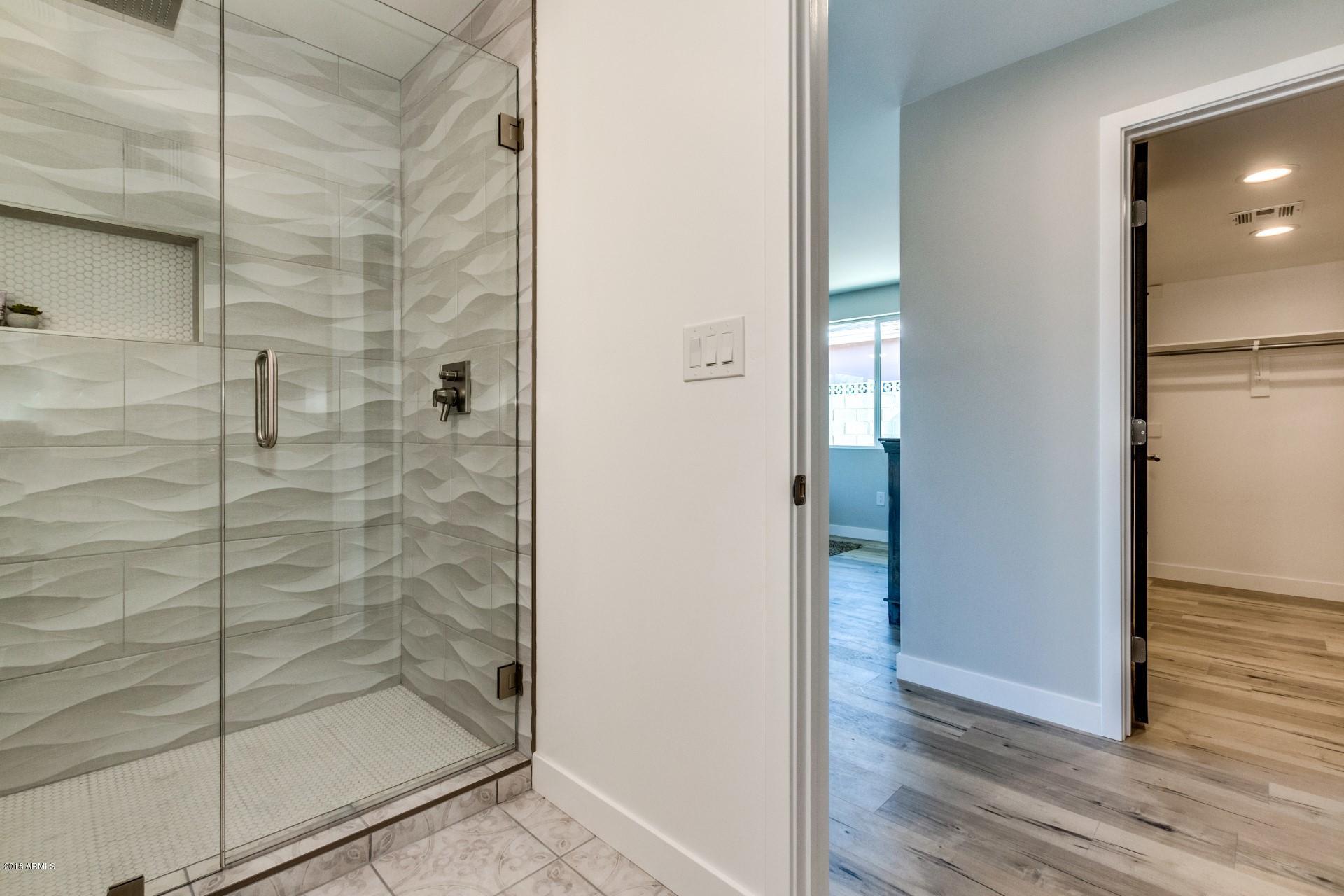1438 East Granada Road Phoenix, AZ 85006 - Photo 29 of 35 a bathroom with a glass shower door