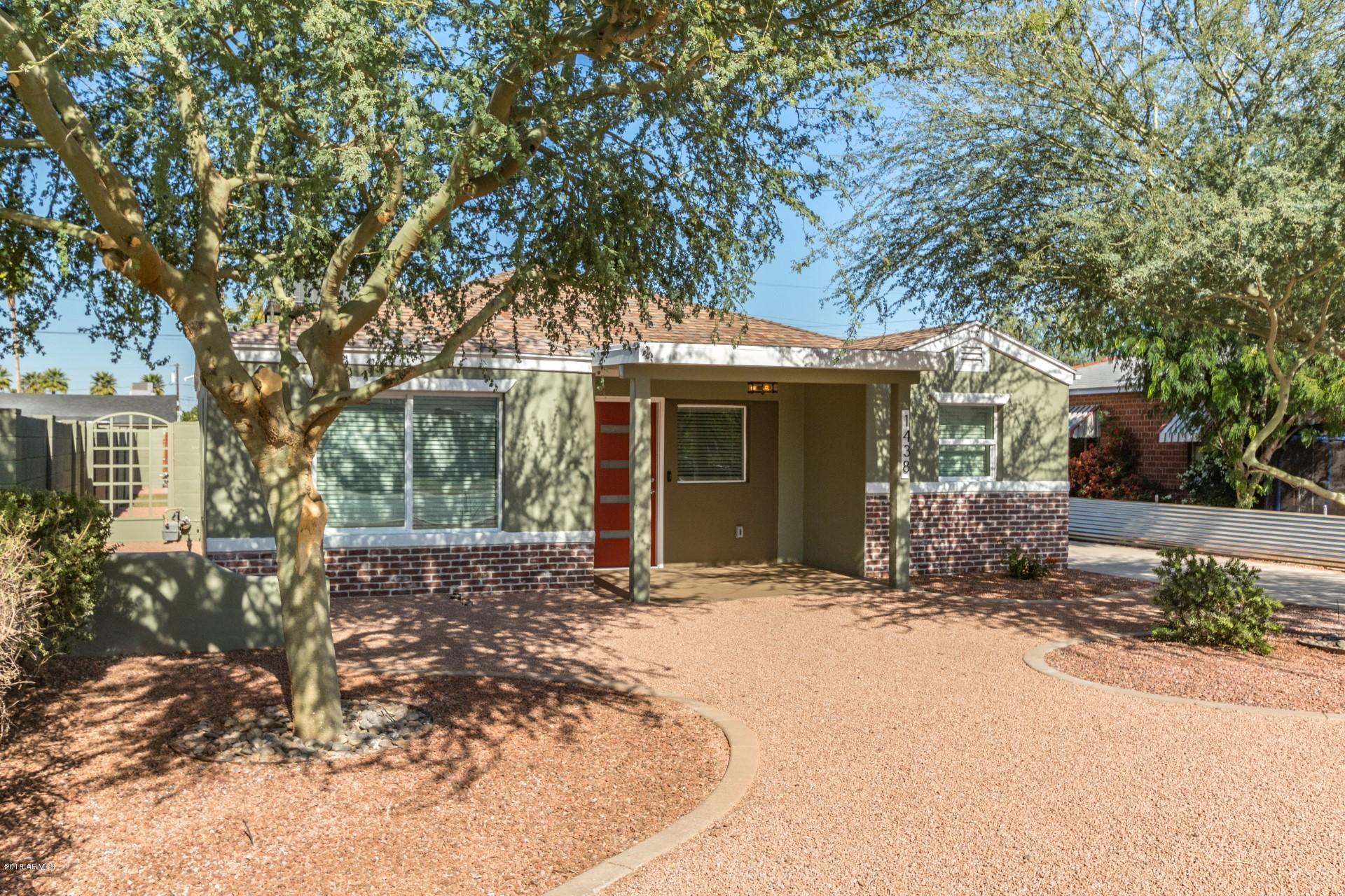 1438 East Granada Road Phoenix, AZ 85006 - Photo 3 of 35 a view of a house with a tree in front