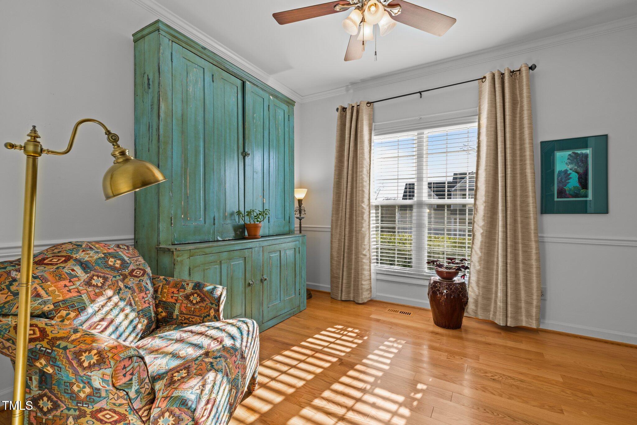 203 Stoney Drive Durham, NC 27703 - Photo 15 of 59 a bedroom with a bed and a chandelier