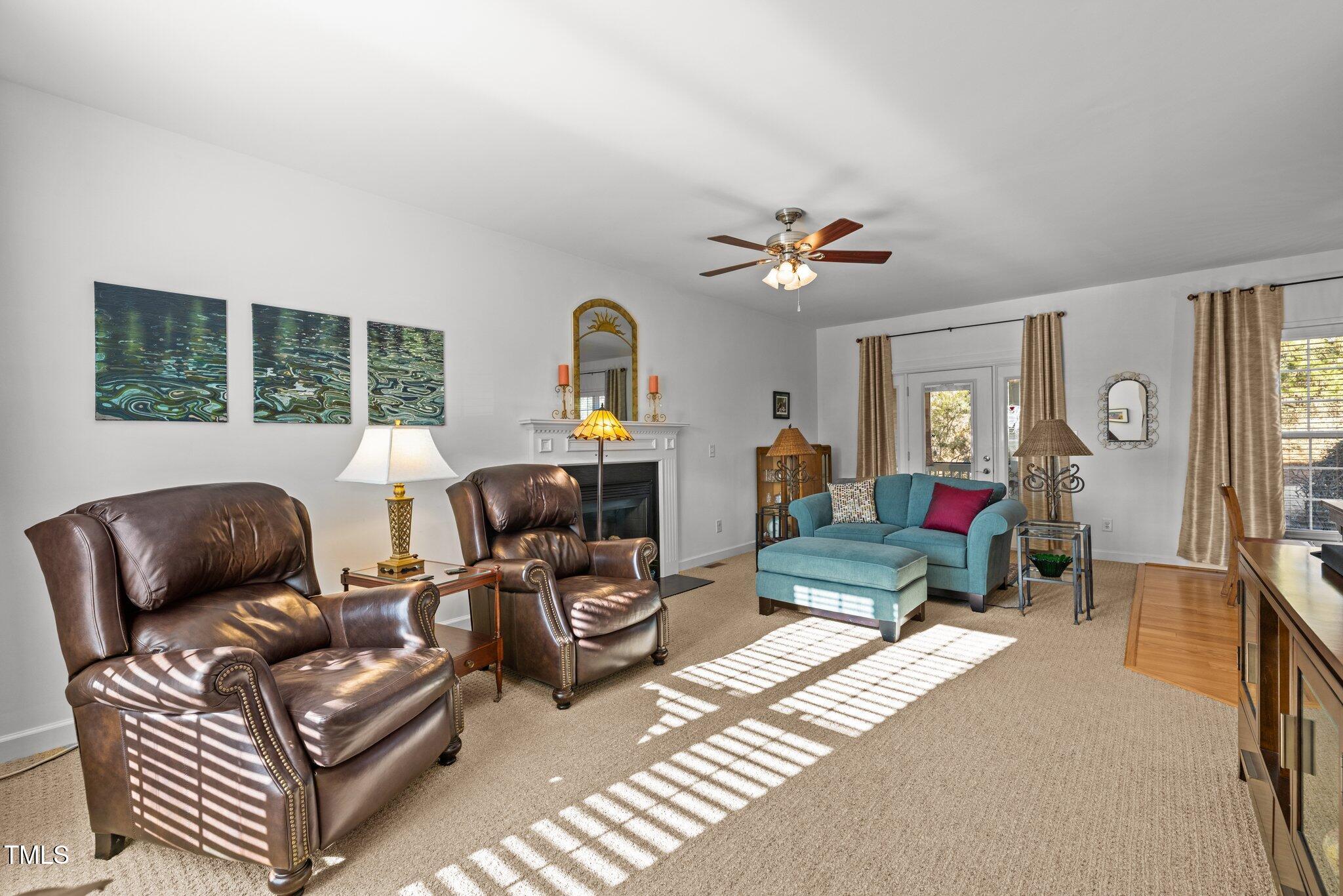203 Stoney Drive Durham, NC 27703 - Photo 17 of 59 a living room with furniture a fireplace and a window