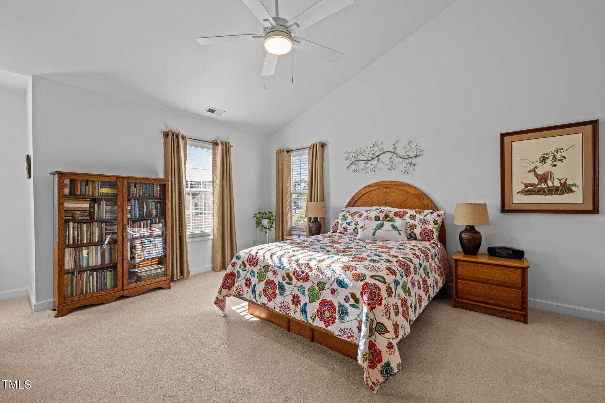 203 Stoney Drive Durham, NC 27703 - Photo 27 of 59 a bedroom with a bed and a large window