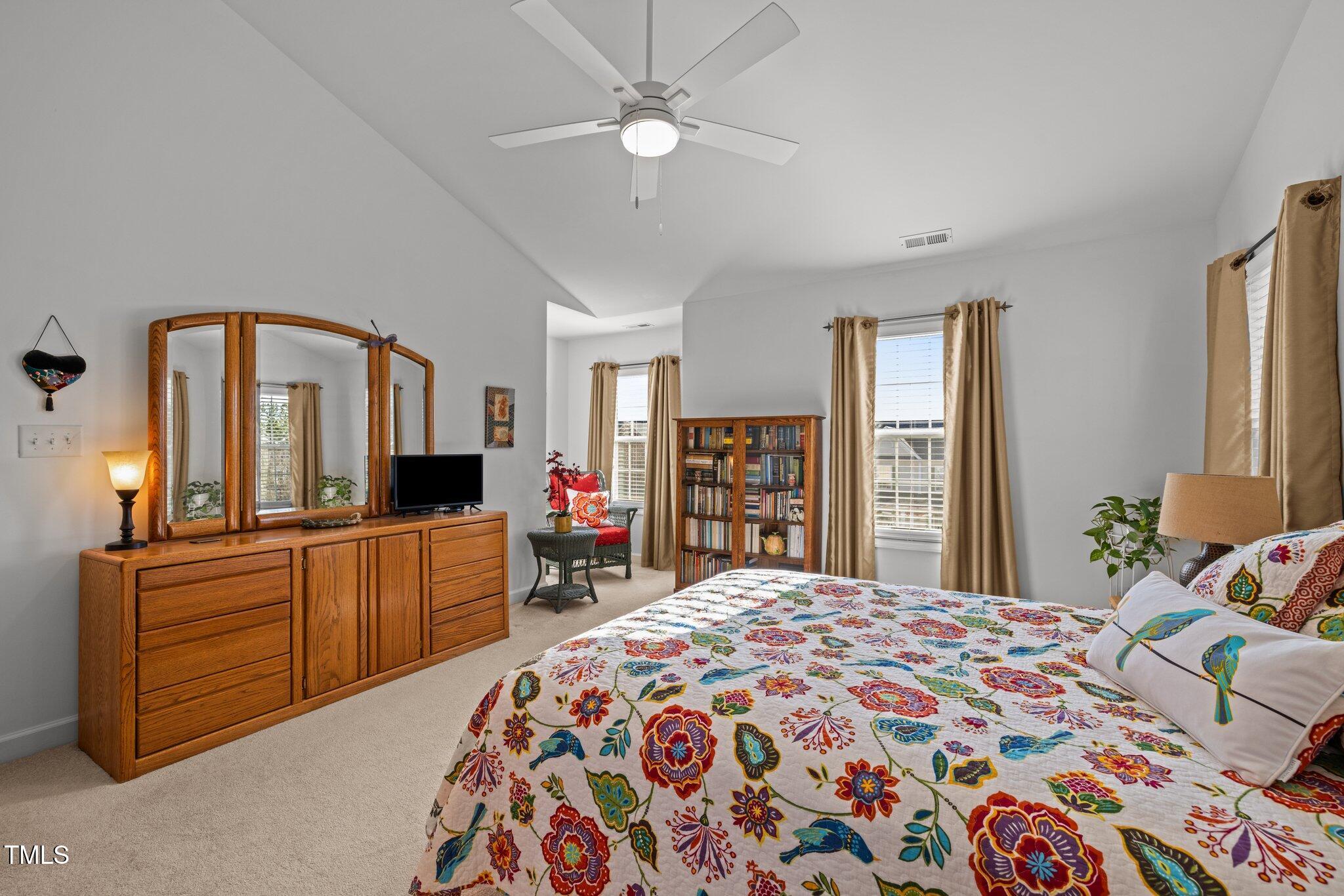 203 Stoney Drive Durham, NC 27703 - Photo 28 of 59 a bedroom with a bed and a dresser in it