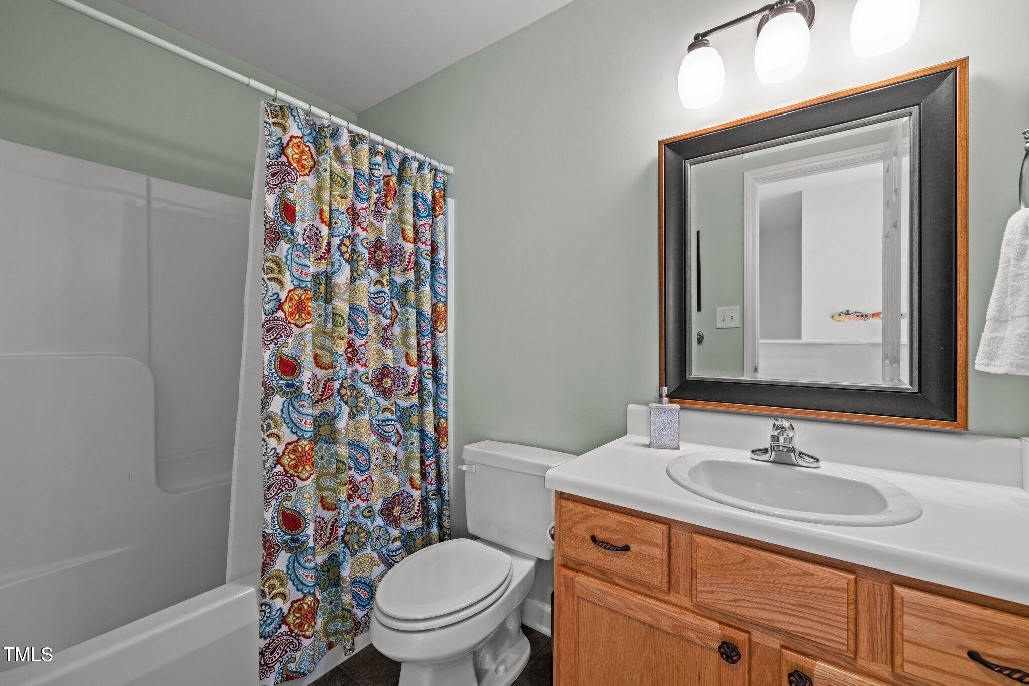 203 Stoney Drive Durham, NC 27703 - Photo 39 of 59 a bathroom with a sink toilet and shower