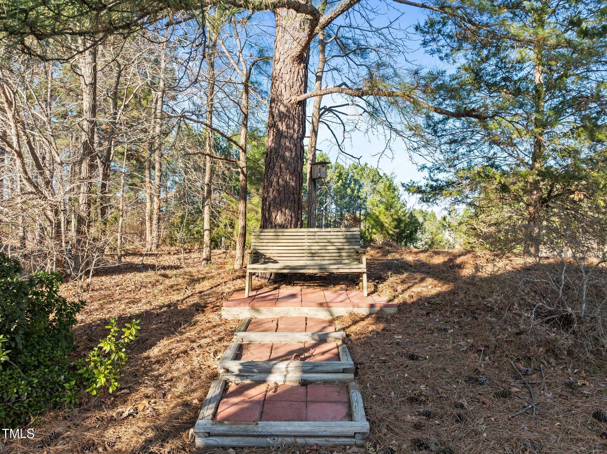 203 Stoney Drive Durham, NC 27703 - Photo 44 of 59 a backyard of a house with a yard and garage