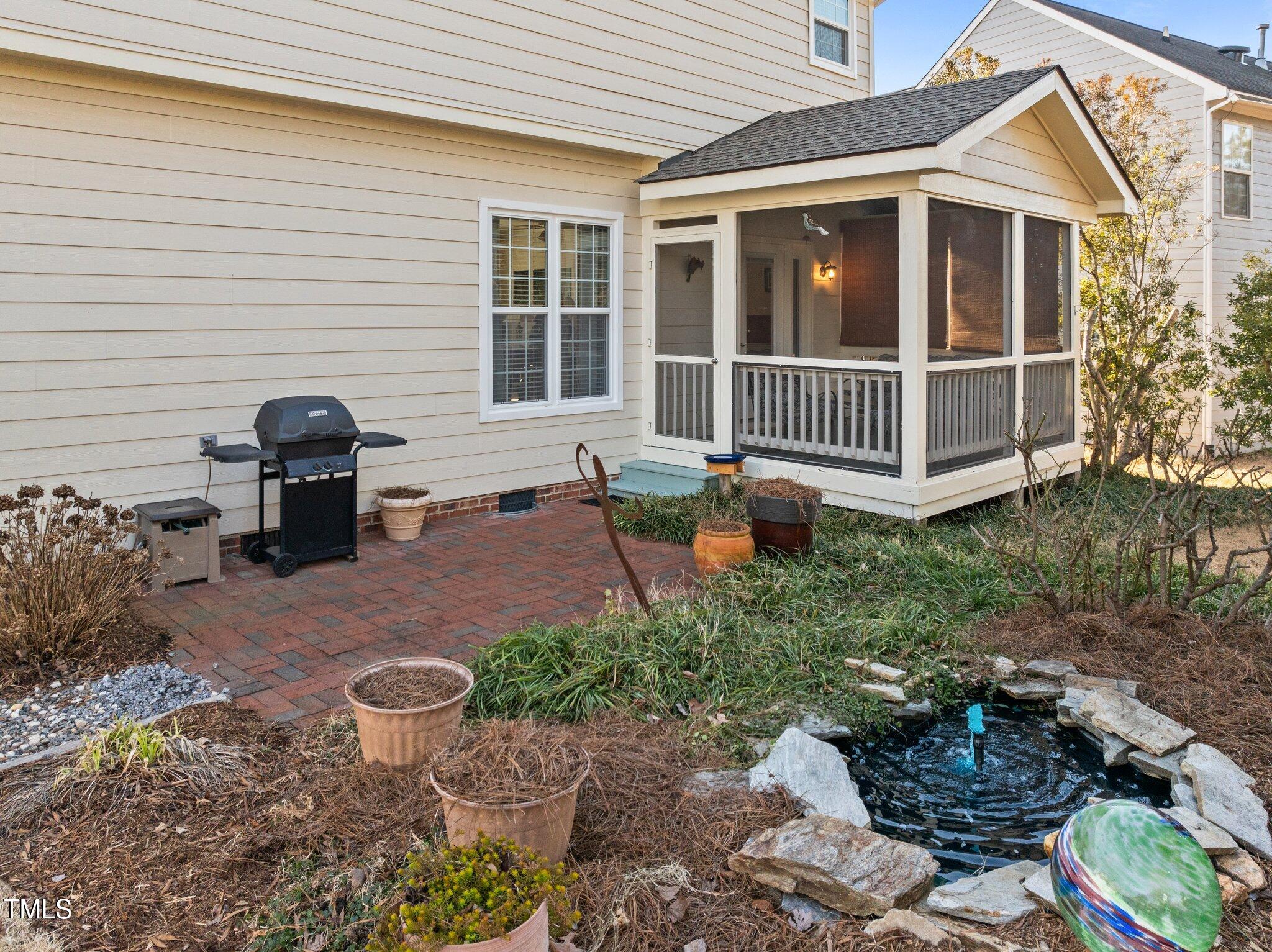 203 Stoney Drive Durham, NC 27703 - Photo 45 of 59 a view of a chair and table on the backyard