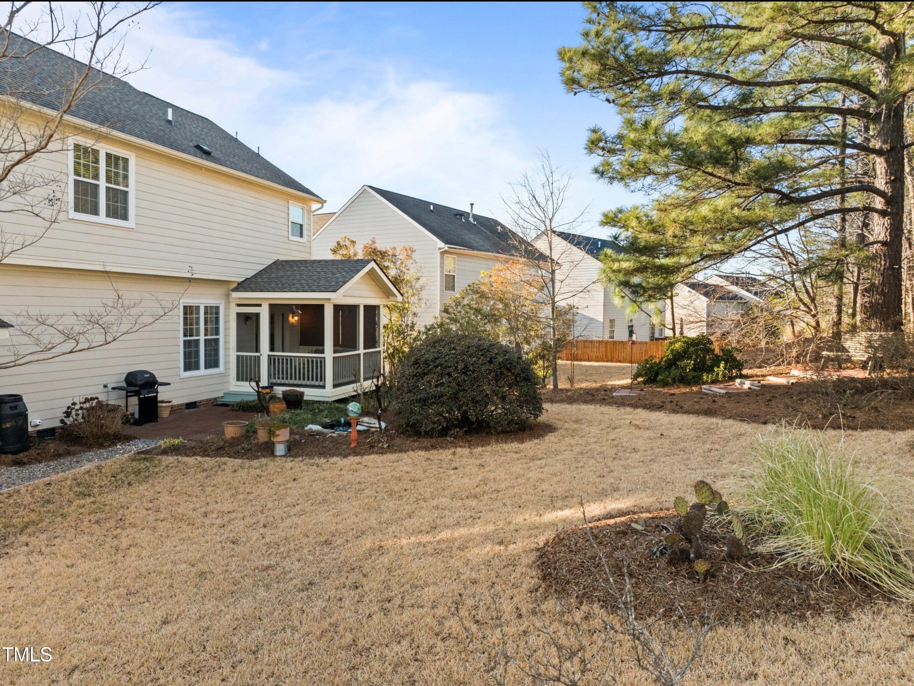 203 Stoney Drive Durham, NC 27703 - Photo 46 of 59 a view of a house with yard and sitting area