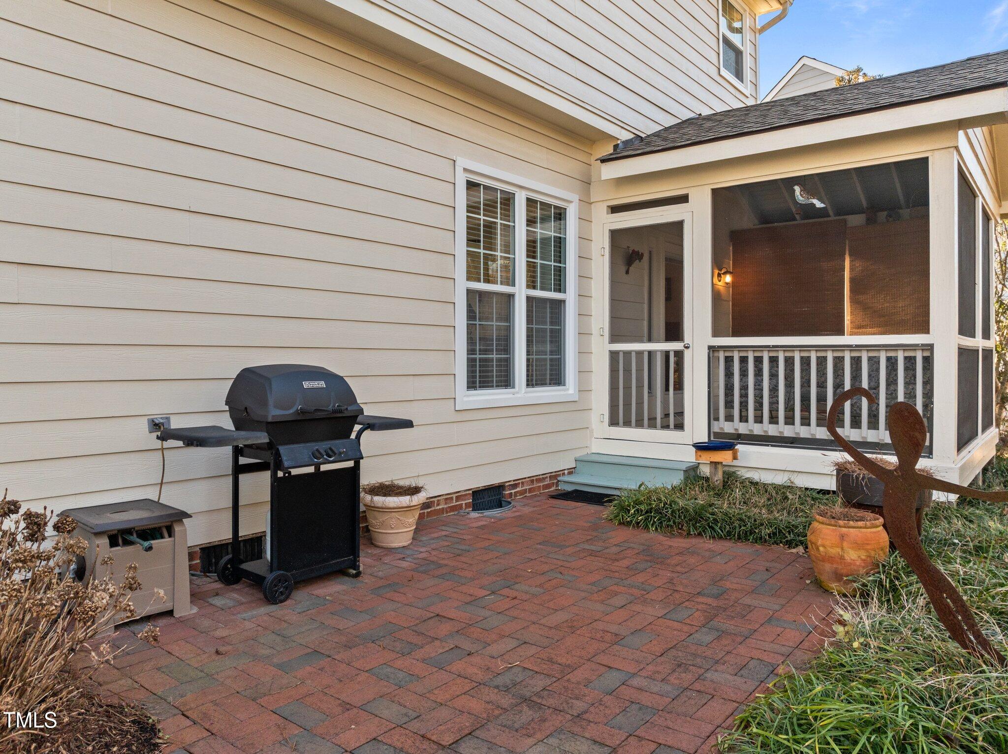 203 Stoney Drive Durham, NC 27703 - Photo 48 of 59 a front view of a house with a bench