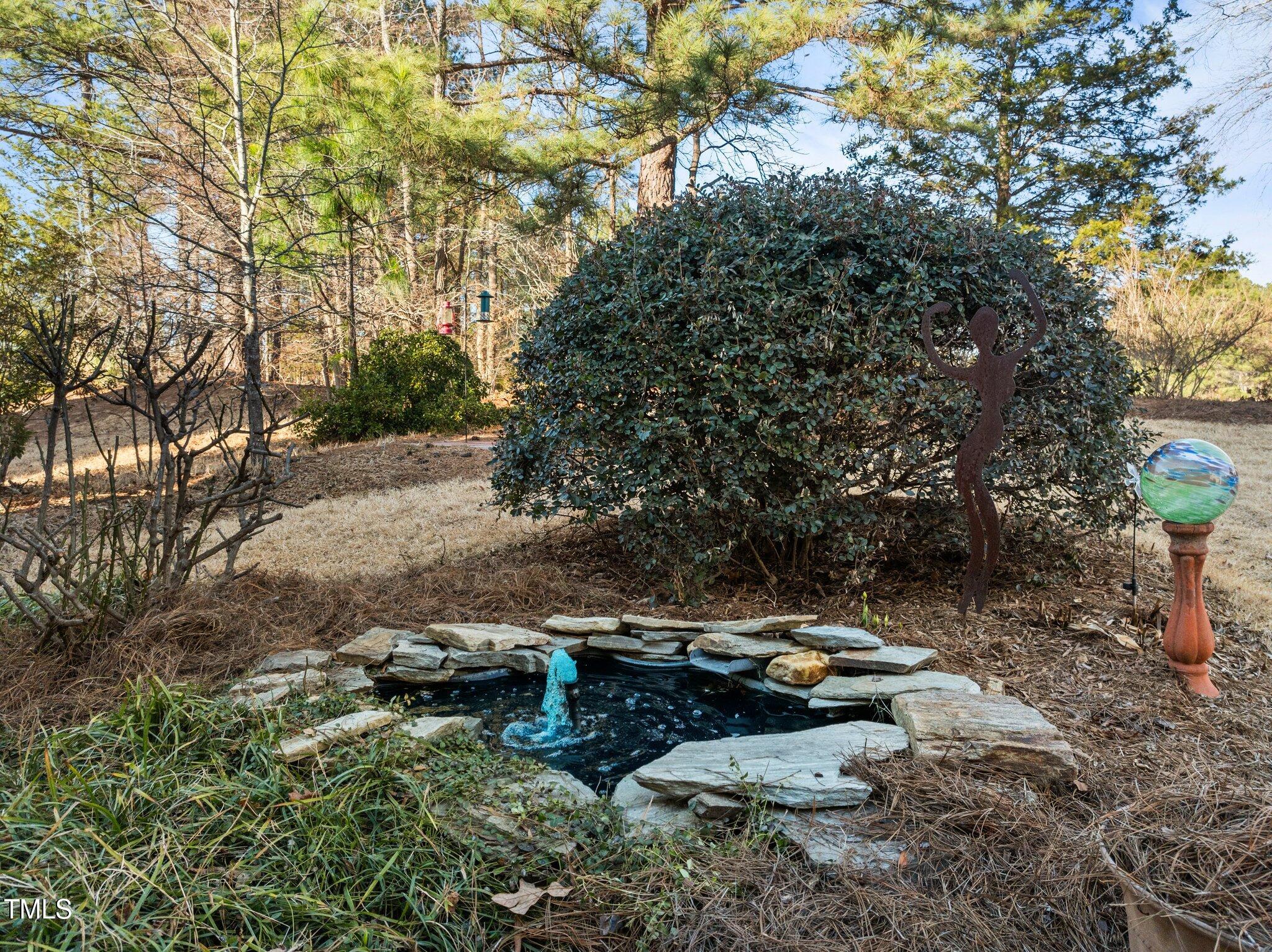 203 Stoney Drive Durham, NC 27703 - Photo 49 of 59 a view of a backyard with plants and trees