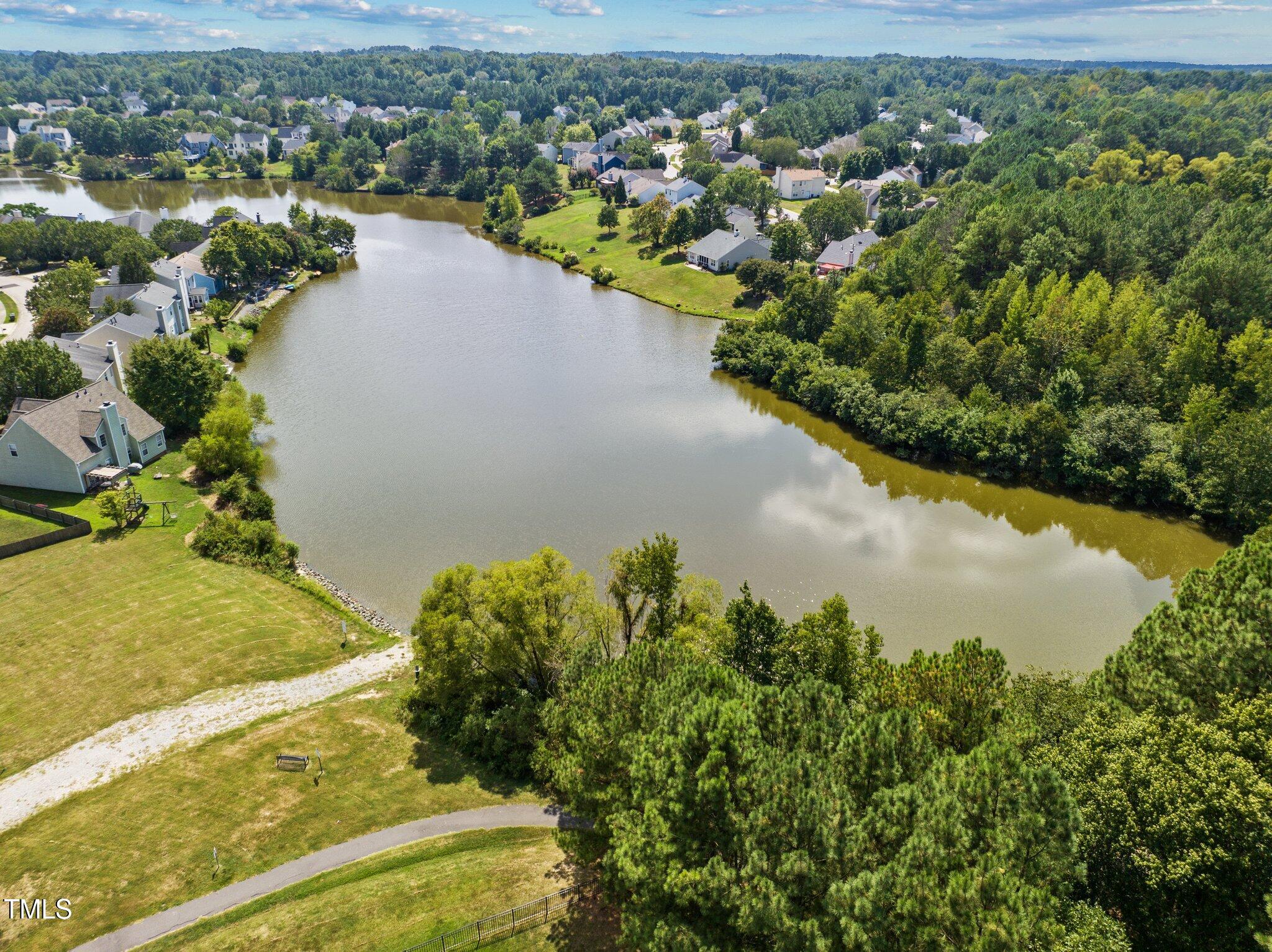 203 Stoney Drive Durham, NC 27703 - Photo 55 of 59 an aerial view of a houses with a lake view