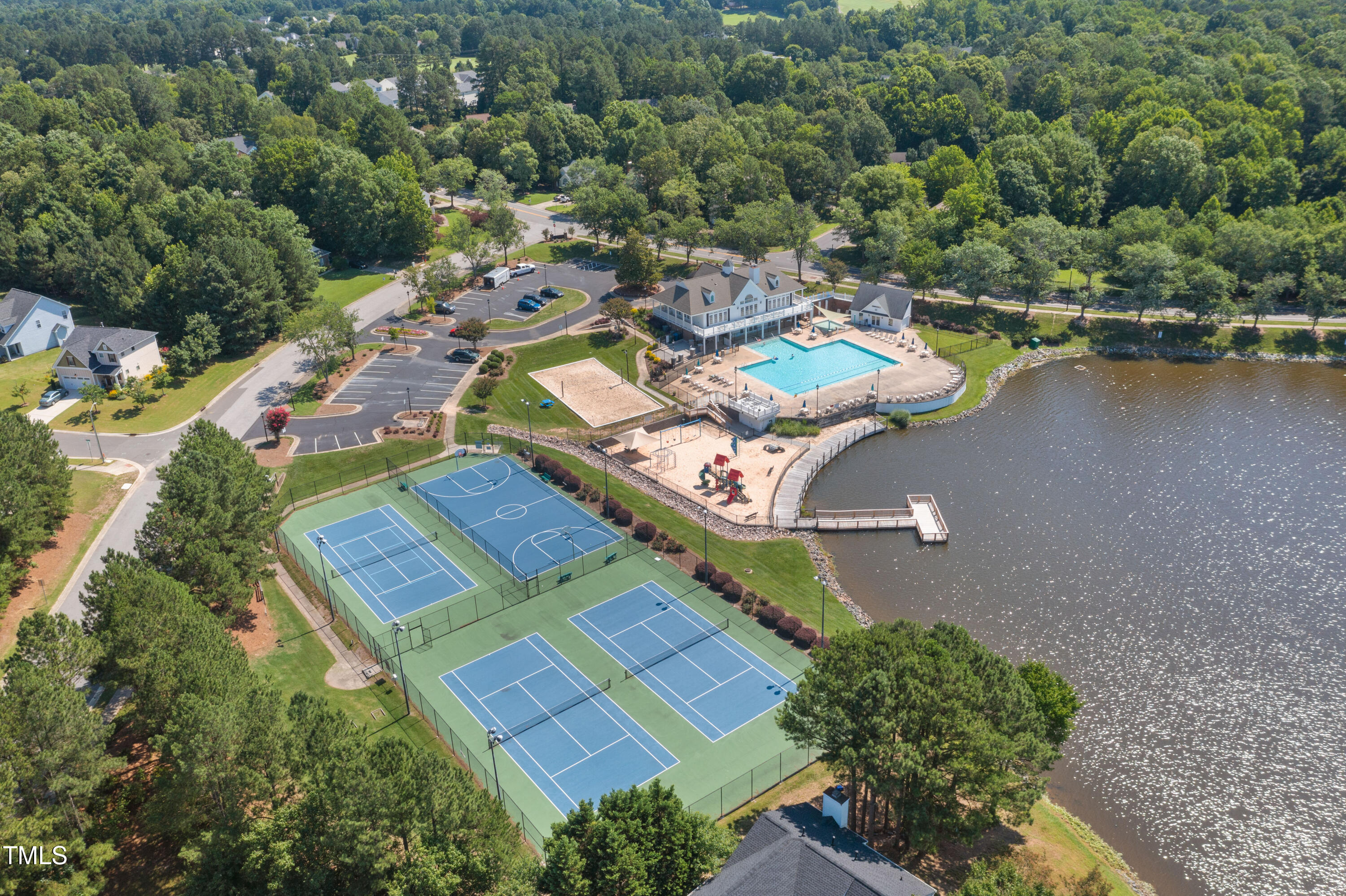 203 Stoney Drive Durham, NC 27703 - Photo 59 of 59 an aerial view of a house with a lake view