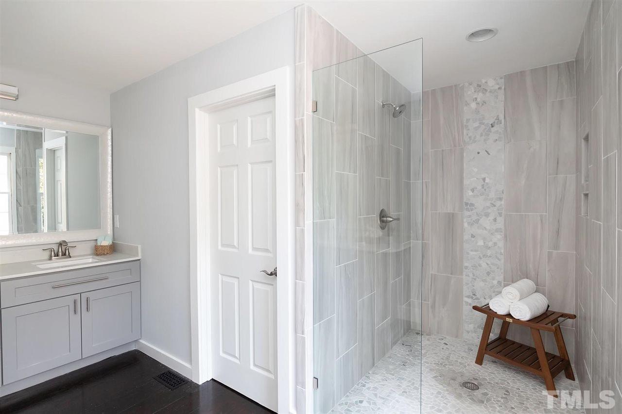5501 Knollwood Road Raleigh, NC 27609 - Photo 14 of 25 a bathroom with a sink and a mirror