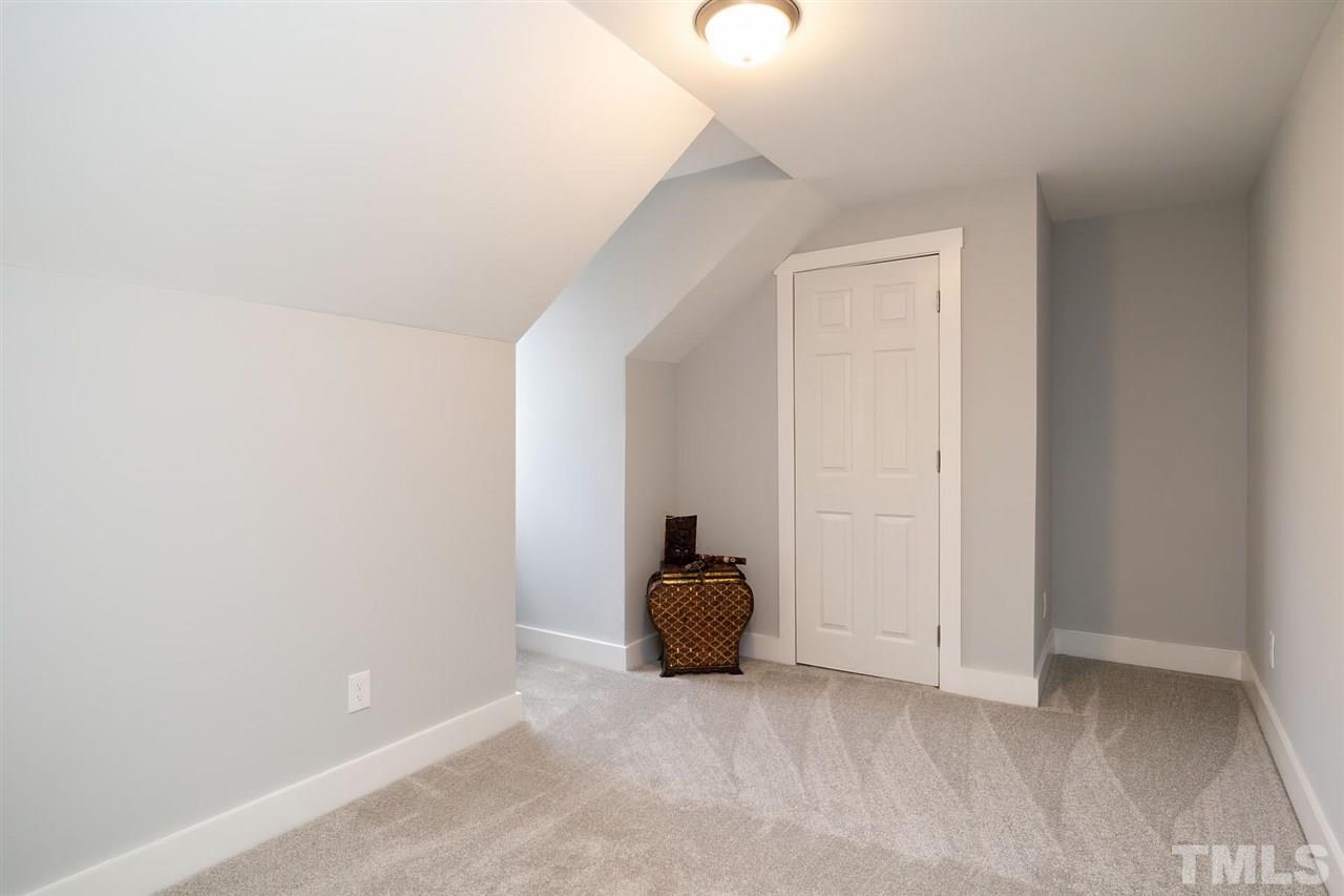 5501 Knollwood Road Raleigh, NC 27609 - Photo 21 of 25 a view of room with window and stairs