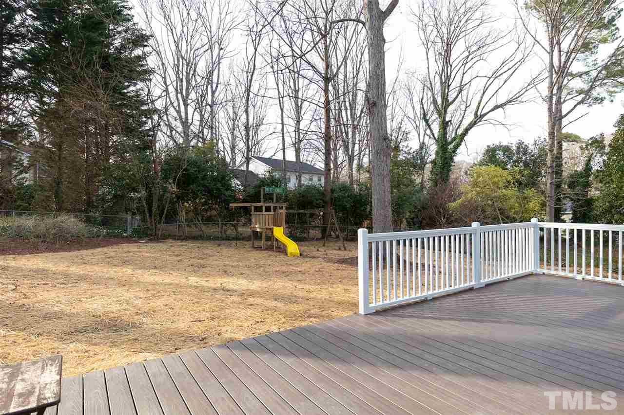 5501 Knollwood Road Raleigh, NC 27609 - Photo 23 of 25 a view of a swimming pool with a patio and wooden fence
